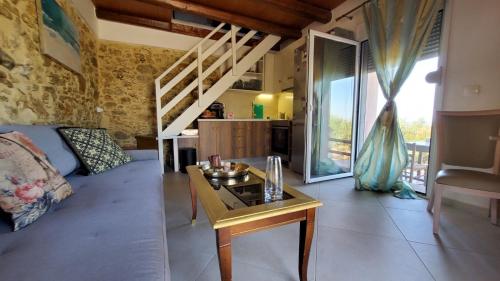 a living room with a couch and a table at Momentum Θ in Maleme