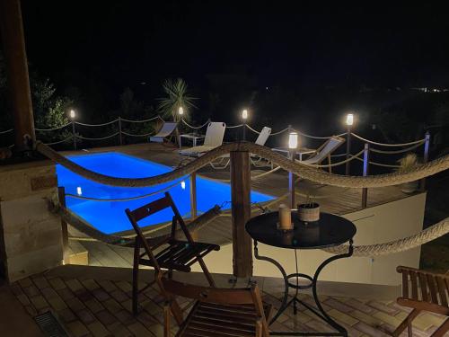 a view of a swimming pool at night at Momentum Θ in Maleme