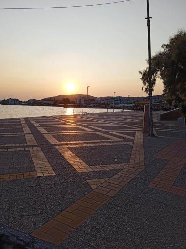 an empty parking lot with the sunset in the background at Dream House in Agria