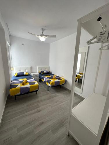 Cama o camas de una habitación en Centro Apartamentos