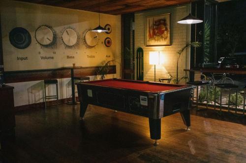 a room with a pool table in the middle of it at Indian Ocean Hotel in Perth