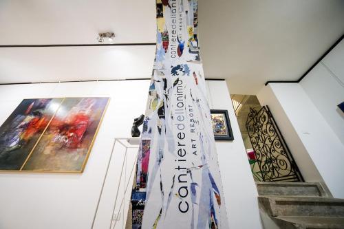 a christmas tree in the hallway of a building at B&B Cantiere dell'anima - Rooms of art in Trapani