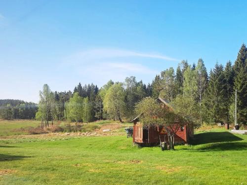 a small cabin in a field of green grass at 5 person holiday home in Fjärås-By Traum in Fjärås