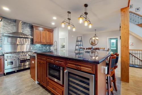 a kitchen with a large island with a counter top at Lobster Shack in Boothbay