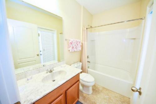 a bathroom with a sink and a toilet and a shower at Make memories with your family and friends in this beautiful home 1014 in Loughman