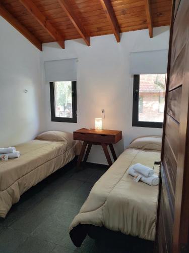 Postel nebo postele na pokoji v ubytování La Trinidad Complejo de Cabañas C1