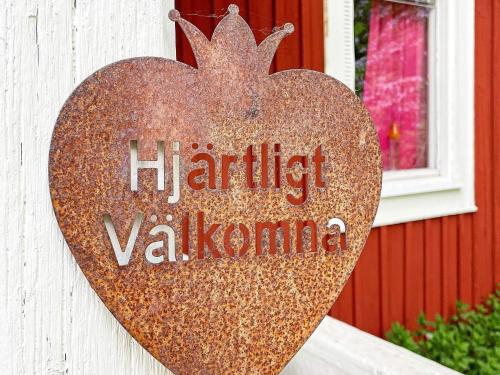 a heart sign on the side of a building at 4 person holiday home in FURUBY-By Traum in Fagereke