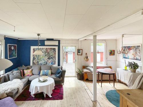 a living room with a couch and a table at 4 person holiday home in FURUBY-By Traum in Fagereke
