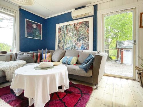 a living room with a couch and a table at 4 person holiday home in FURUBY-By Traum in Fagereke