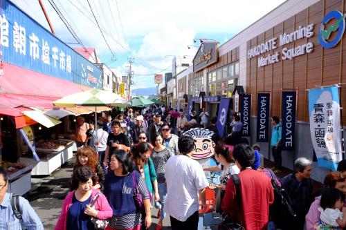 a crowd of people walking down a street in a market at Tokyu Stay Hakodate Asaichi Akarinoyu in Hakodate