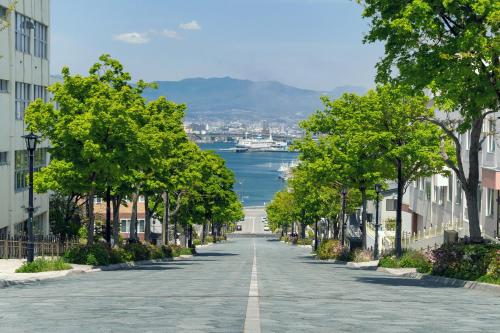 an empty street with a view of the water at Tokyu Stay Hakodate Asaichi Akarinoyu in Hakodate
