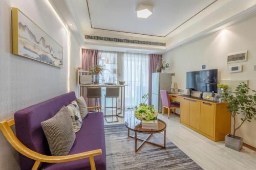 Televisyen dan/atau pusat hiburan di Dingshang Apartment Hotel