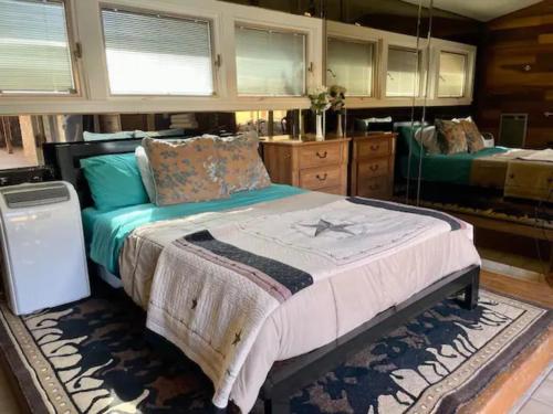 a bedroom with a large bed in a room at Alpine Country Club Lofts in Alpine