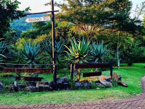 a street sign on a pole in a park at Patogeng Self Catering - Da Gama Dam view in White River