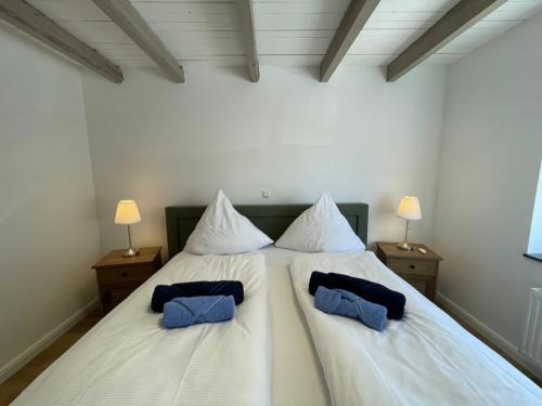 Postel nebo postele na pokoji v ubytování Dinas Huus