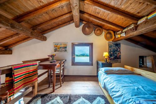 Ένα ή περισσότερα κρεβάτια σε δωμάτιο στο Rustico Ciabott