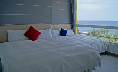 Postel nebo postele na pokoji v ubytování 南灣飯店 Kenting Nanwan Hotel