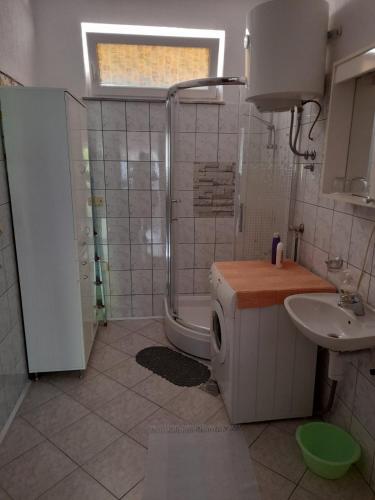a bathroom with a shower and a toilet and a sink at Apartment Mirjana in Banja Luka
