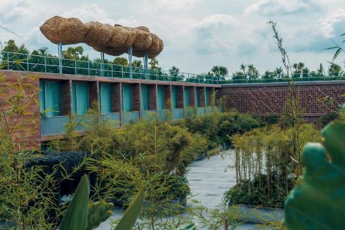 a building with two umbrellas on top of it at Potato Head Suites & Studios in Seminyak