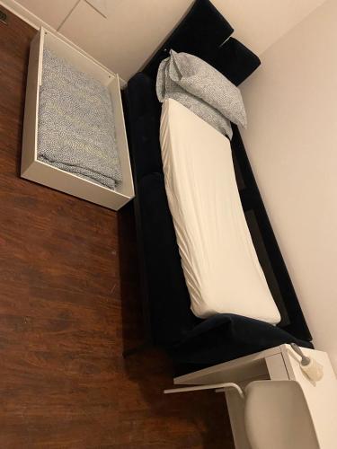 a bunk bed in a room with a bed in it at BUDGET Triple Room with En Suite Bathroom 36A in Toronto