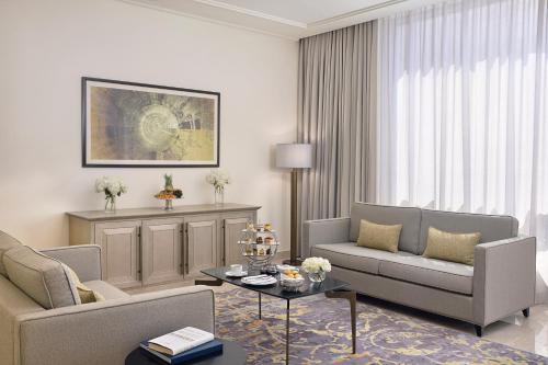 a living room with a couch and a table at Jumeirah Jabal Omar Makkah in Makkah