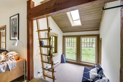 a room with a ladder in a room with windows at Stunning Custom Marble Home with Mountain Views in Marble