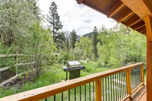a bbq grill on the deck of a cabin at Stunning Custom Marble Home with Mountain Views in Marble