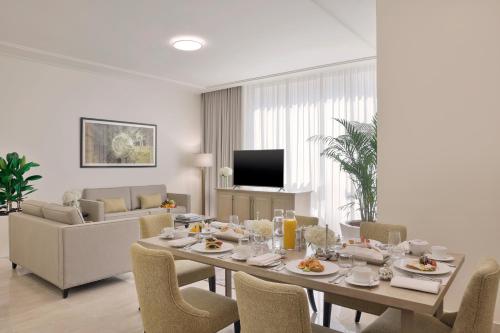 a dining room with a table and chairs at Jumeirah Jabal Omar Makkah in Makkah