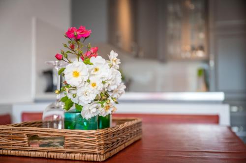 a vase of flowers sitting on top of a table at Wohnung Seeblick in Sattendorf