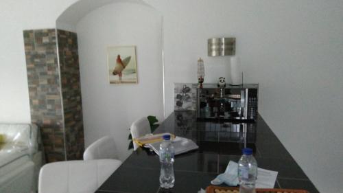 a living room with a table and chairs at tropicana sur apt221 in Sosúa