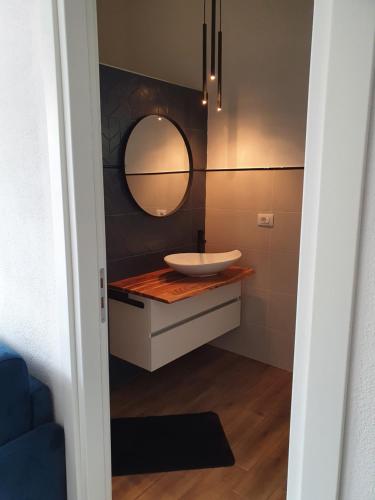 a bathroom with a sink and a mirror at Casa di Giovanna in Scalea