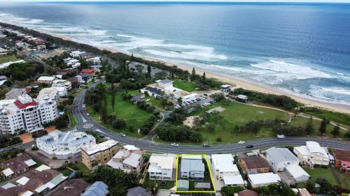 an aerial view of a city and the ocean at Stunning, Beachfront Dream Home - ZA3 in Buddina