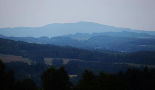 a view of a valley with trees and hills at Hájenka hraběte Buquoye in Kaplice