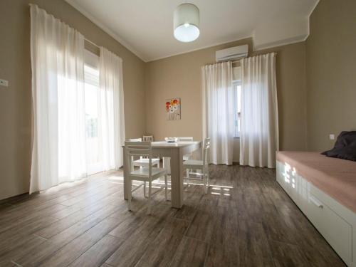 a bedroom with a desk and a bed and a table at Villa Paestum in Paestum