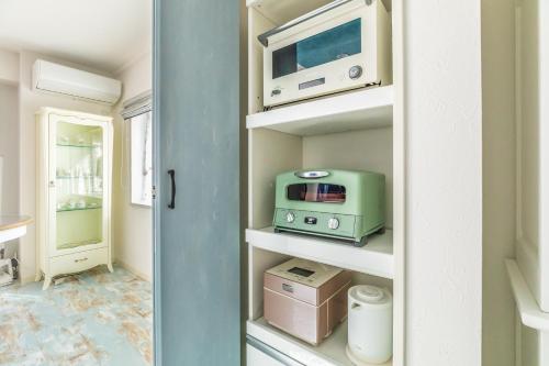 Una cocina o cocineta en ルグランみしま