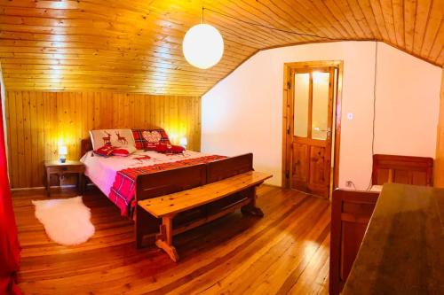 a bedroom with a bed and a wooden floor at Alpine Majestic Escape - Balcone sulle Piste di Sci CIR 0102 in Champoluc