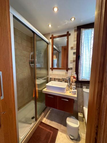 a bathroom with a shower and a sink and a toilet at Sotira Agia Napa Luxury House in Ayia Napa