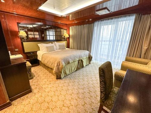 a bedroom on a cruise ship with a bed at Captain Cook Cruises Fiji in Denarau