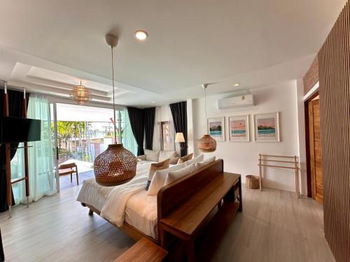 a bedroom with a large bed with a large vase on it at Villa Vara - Tropical Pool Villa in Ao Nang Beach