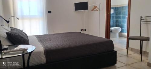 Posteľ alebo postele v izbe v ubytovaní SALENTO MARE