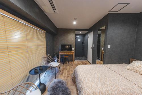 Cama o camas de una habitación en Inn The Omotesando