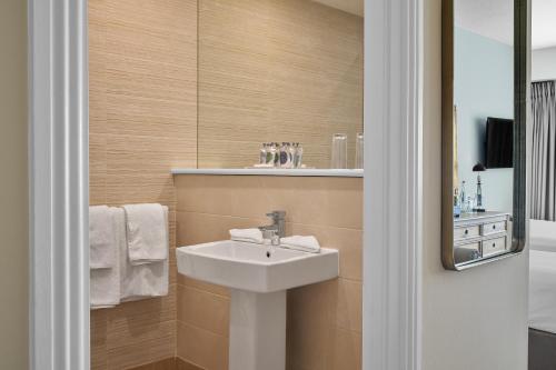 a bathroom with a sink and a mirror at Summerhill House Hotel in Enniskerry