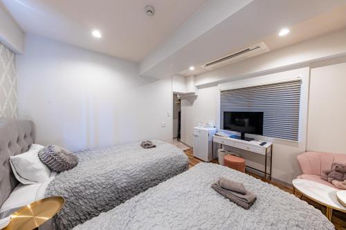 Cama o camas de una habitación en Inn The Omotesando