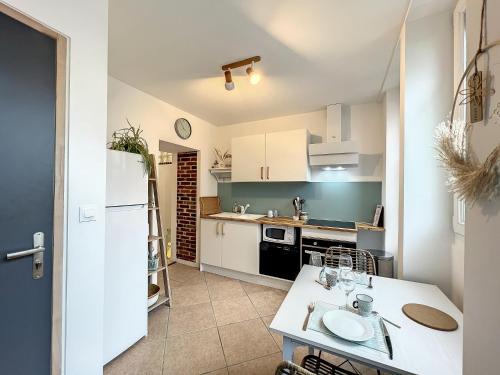 Kuchyň nebo kuchyňský kout v ubytování Appart LE SCANDINAVE - Maison 1911 - confort & prestige