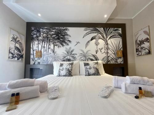Postel nebo postele na pokoji v ubytování Hermitage Suites