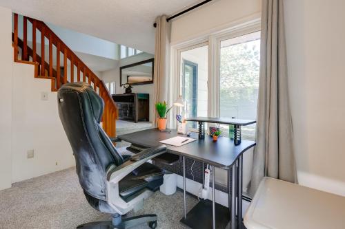 a home office with a desk and a chair at 3 Mi to Pioneer Park and University Spacious Home! in Fairbanks