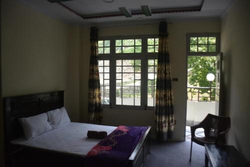 En eller flere senge i et værelse på Miandam Last Resort