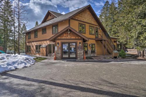 a large wooden house with a driveway at Cozy Resort Condo about 2 Mi to Whitefish Mtn Resort! in Whitefish