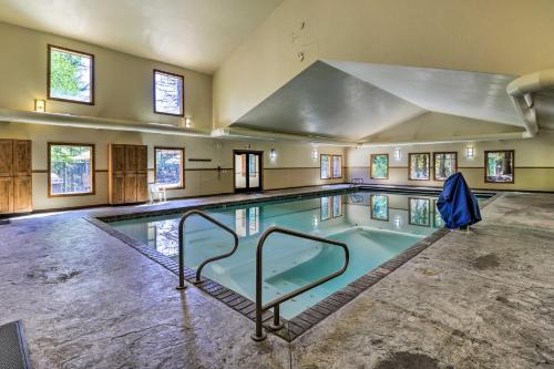 a large swimming pool in a building at Cozy Resort Condo about 2 Mi to Whitefish Mtn Resort! in Whitefish