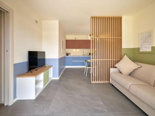 Ένα ή περισσότερα κρεβάτια σε δωμάτιο στο Leti Apartments Garda